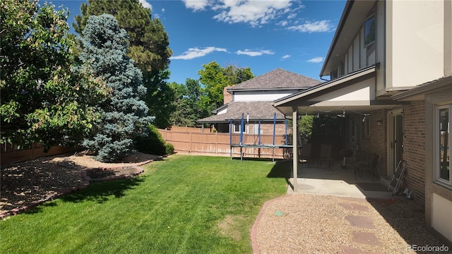 16639 E Berry Ln, Centennial, CO 80015 - view of yard featuring a trampoline and a patio area