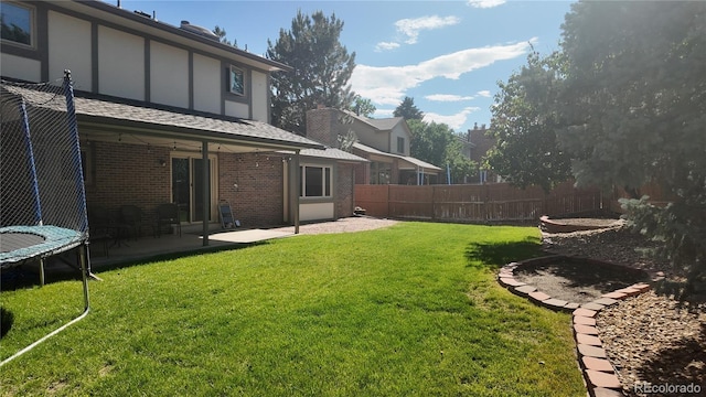 16639 E Berry Ln, Centennial, CO 80015 - view of yard with a trampoline and a patio area