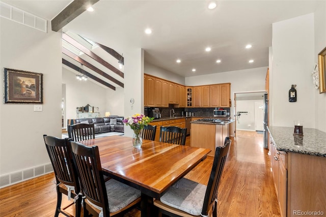 1851 E 138th Ave, Brighton, CO 80602 - dining area with light wood-style floors, beamed ceiling, and recessed lighting