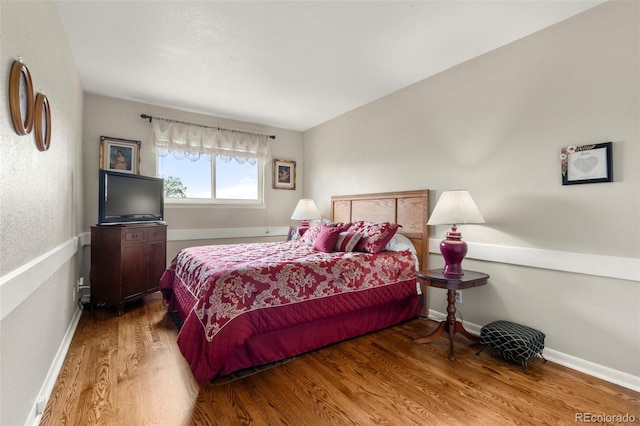 1851 E 138th Ave, Brighton, CO 80602 - bedroom with wood finished floors and baseboards