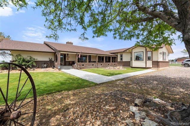 1851 E 138th Ave, Brighton, CO 80602 - ranch-style home with brick siding, a chimney, a front lawn, and covered porch