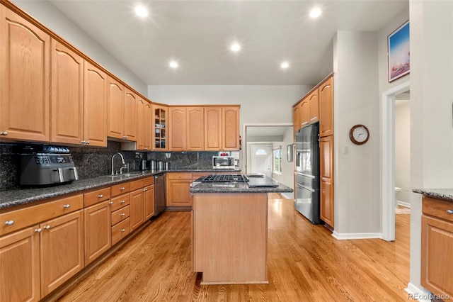 1851 E 138th Ave, Brighton, CO 80602 - kitchen with stainless steel appliances, a center island, tasteful backsplash, glass insert cabinets, and a sink