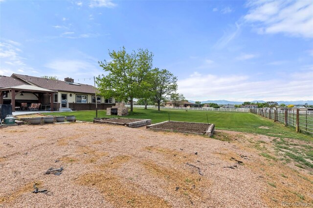 1851 E 138th Ave, Brighton, CO 80602 - view of yard with a gazebo, a garden, a patio, and a mountain view