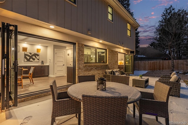 11861 E Yale Ct, Aurora, CO 80014 - view of patio featuring an outdoor living space, outdoor dining area, and a wooden deck