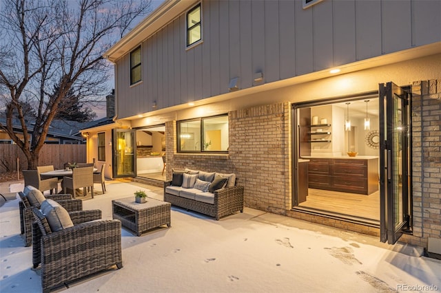11861 E Yale Ct, Aurora, CO 80014 - patio terrace at dusk with an outdoor hangout area and a patio