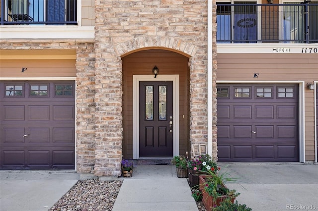 entrance to property with a balcony