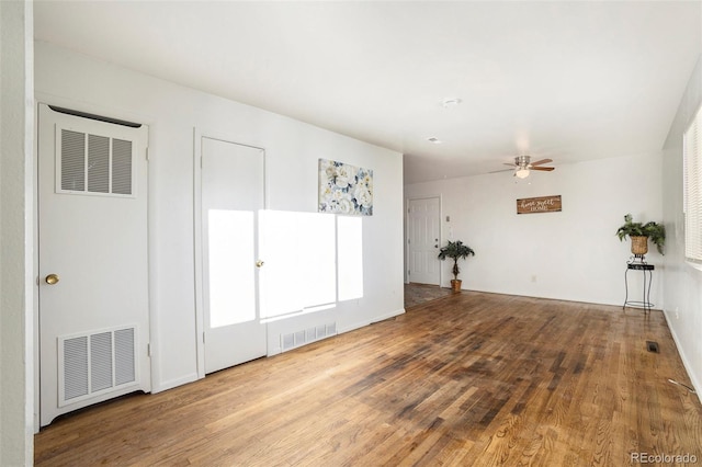 empty room featuring ceiling fan and hardwood / wood-style flooring