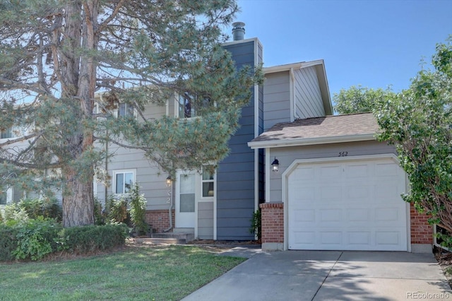 562 W Crestline Cir Unit 7D, Littleton, CO 80120 - view of front facade with brick siding, driveway, a garage, a front yard, and a chimney
