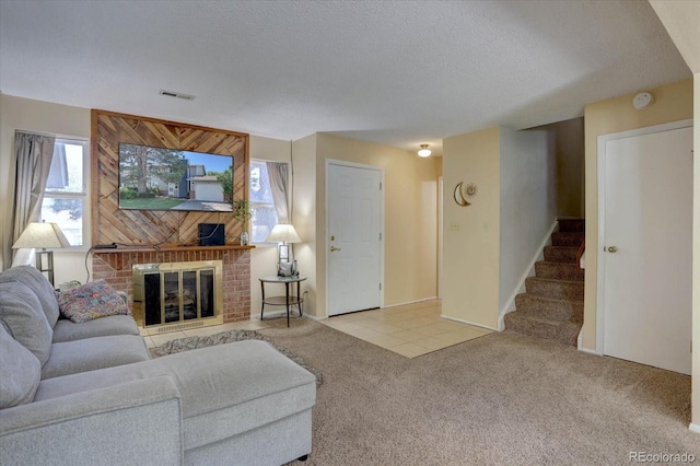 562 W Crestline Cir Unit 7D, Littleton, CO 80120 - carpeted living room with stairway, a fireplace, and a textured ceiling