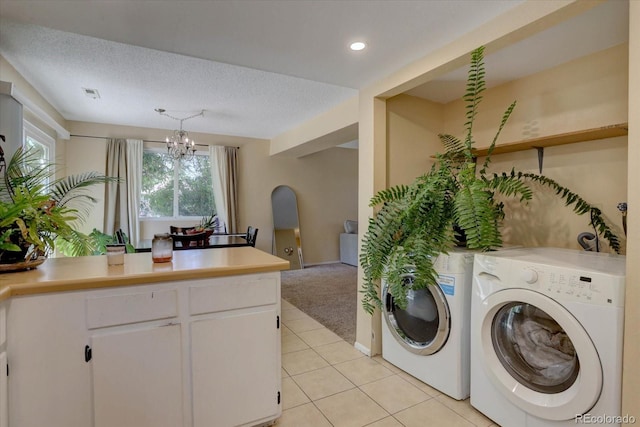 562 W Crestline Cir Unit 7D, Littleton, CO 80120 - laundry area with separate washer and dryer, light tile patterned floors, a chandelier, light colored carpet, and recessed lighting