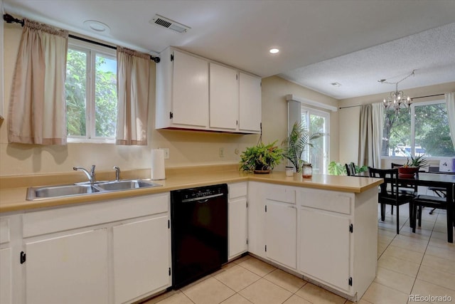 562 W Crestline Cir Unit 7D, Littleton, CO 80120 - kitchen with dishwasher, plenty of natural light, white cabinetry, recessed lighting, and a textured ceiling