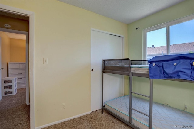 562 W Crestline Cir Unit 7D, Littleton, CO 80120 - bedroom with carpet and baseboards