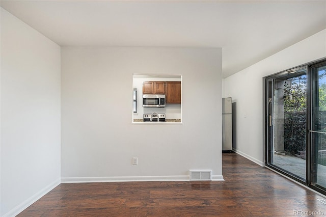 1233 S Yosemite Way Unit 74, Denver, CO 80247 - empty room with dark wood-style floors