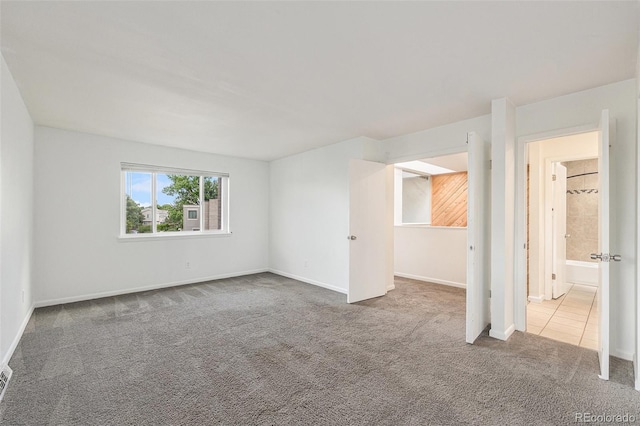 1233 S Yosemite Way Unit 74, Denver, CO 80247 - empty room featuring carpet flooring and baseboards