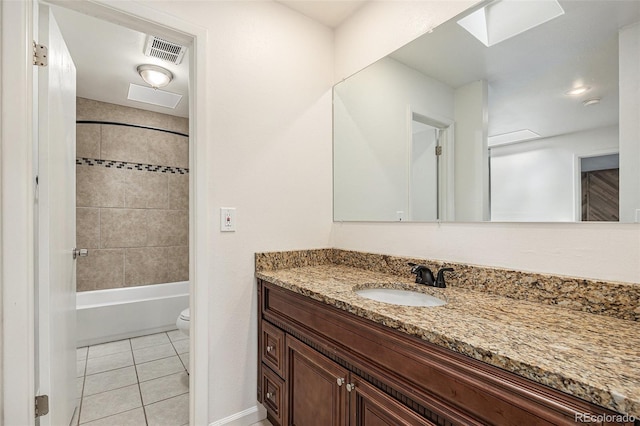 1233 S Yosemite Way Unit 74, Denver, CO 80247 - bathroom with vanity, tile patterned flooring, and tub / shower combination