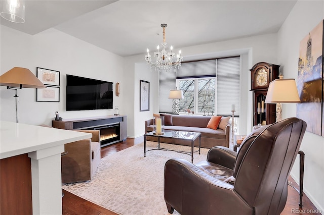 living room featuring dark hardwood / wood-style flooring and a notable chandelier