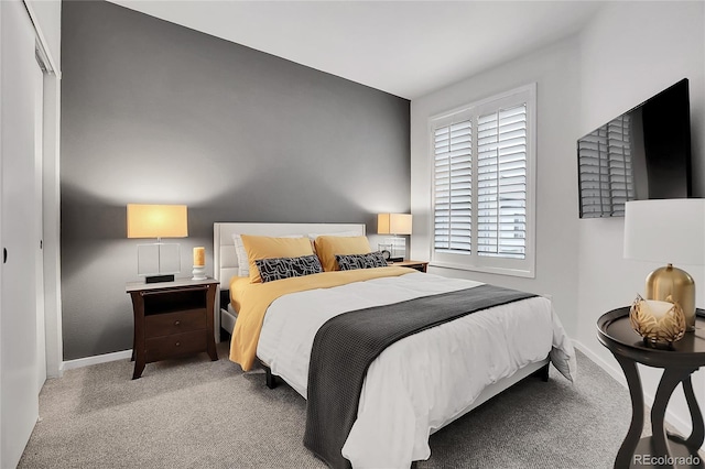 carpeted bedroom featuring a closet