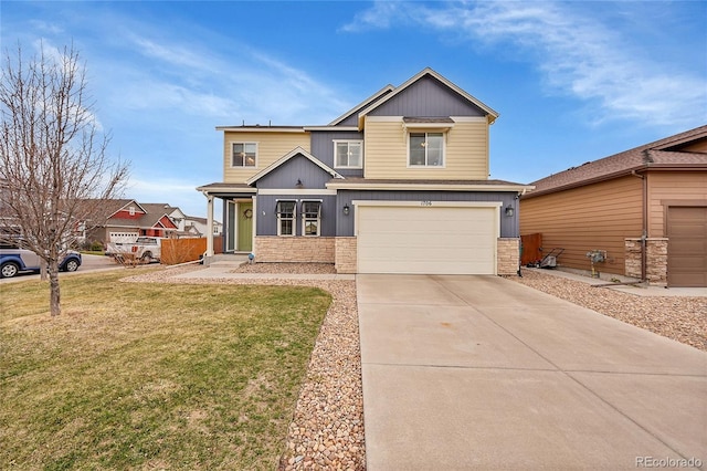 craftsman house with concrete driveway, a front lawn, and an attached garage