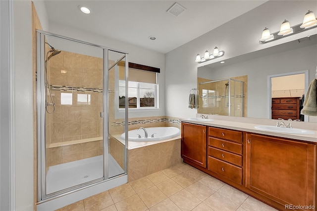 full bathroom with a garden tub, a sink, visible vents, tile patterned floors, and a stall shower