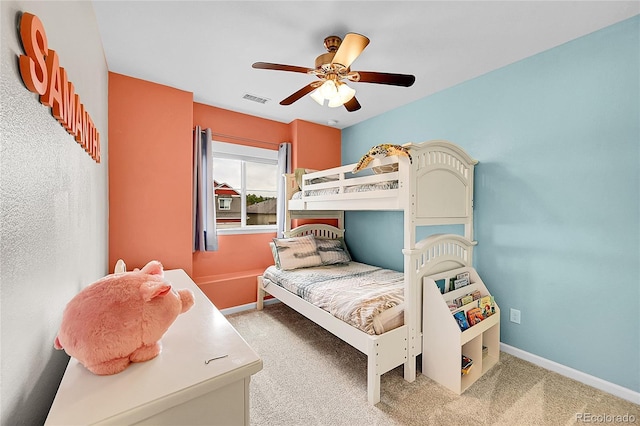 bedroom featuring carpet floors, visible vents, and baseboards