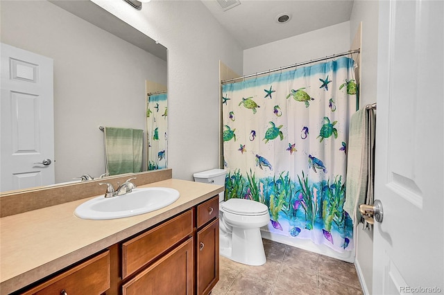 full bathroom featuring toilet, tile patterned floors, curtained shower, and vanity