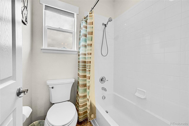 bathroom featuring toilet and shower / tub combo with curtain