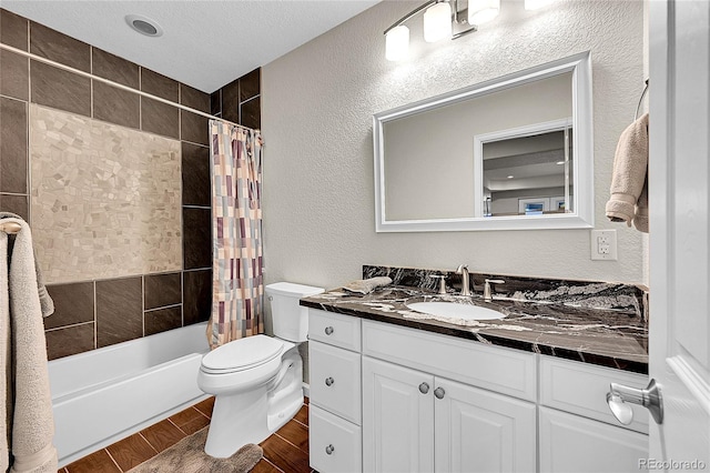 bathroom with shower / bathtub combination with curtain, wood finish floors, and a textured wall