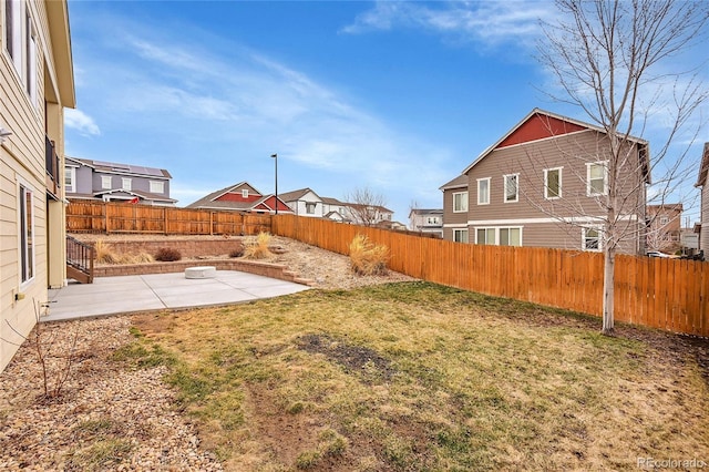 view of yard with a patio and a fenced backyard