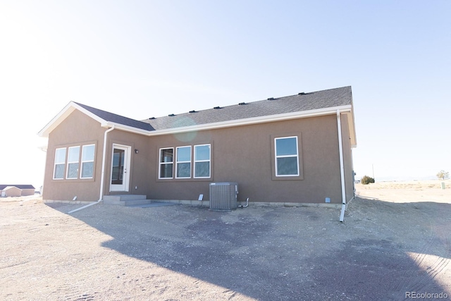 back of house with cooling unit