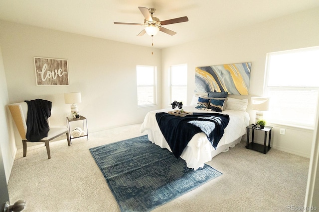 bedroom with light colored carpet and ceiling fan