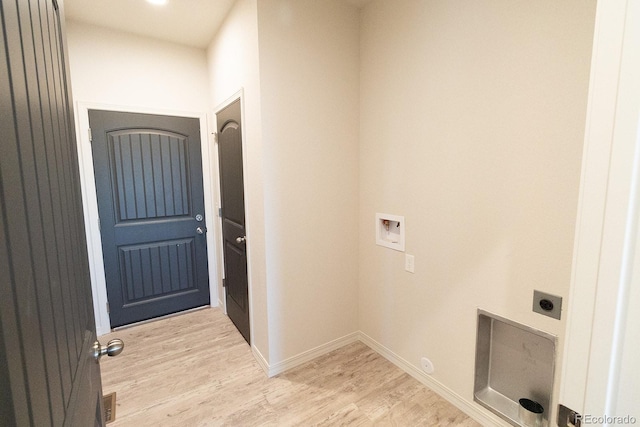 laundry room with electric dryer hookup, hookup for a washing machine, and light hardwood / wood-style flooring