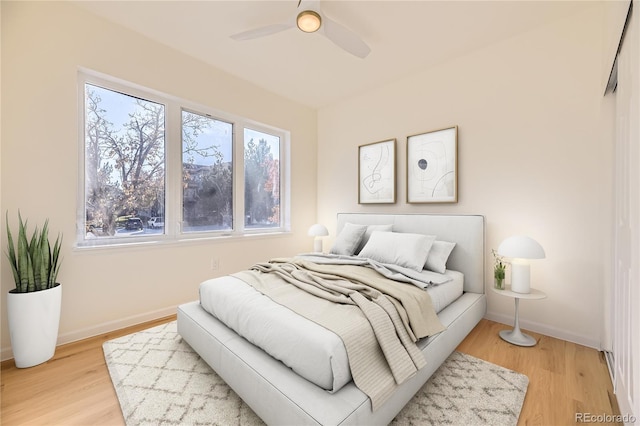 bedroom featuring hardwood / wood-style flooring and ceiling fan