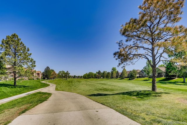 view of home's community featuring a lawn