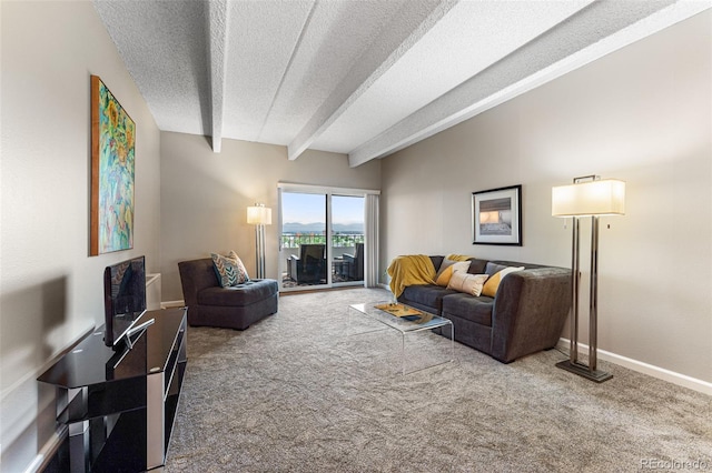 living area with carpet floors, beamed ceiling, a textured ceiling, and baseboards