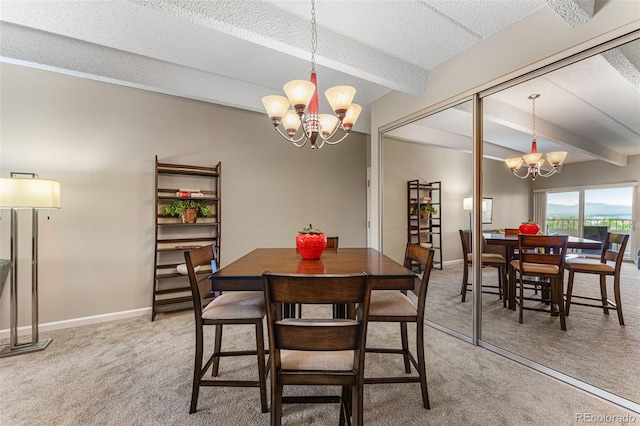 carpeted dining area featuring a textured ceiling, beamed ceiling, baseboards, and a notable chandelier