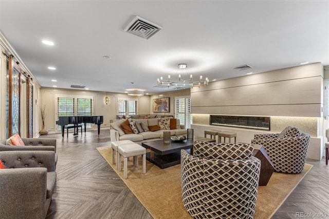 living room featuring recessed lighting, visible vents, and a fireplace