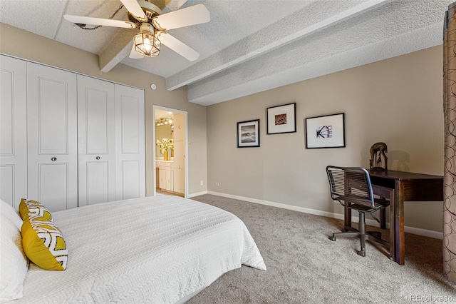 bedroom featuring carpet floors, a closet, a textured ceiling, beamed ceiling, and baseboards