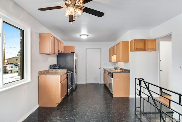 kitchen with ceiling fan, stainless steel appliances, and sink