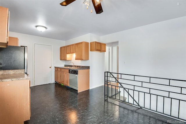 kitchen featuring ceiling fan, stainless steel appliances, and sink