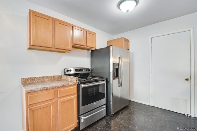 kitchen featuring light brown cabinets, light countertops, and appliances with stainless steel finishes