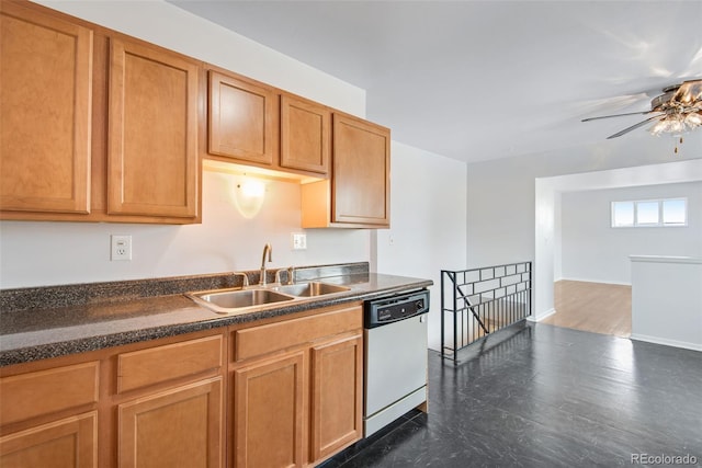 kitchen featuring a sink, brown cabinets, ceiling fan, white dishwasher, and dark countertops