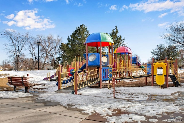 snow covered playground featuring playground community