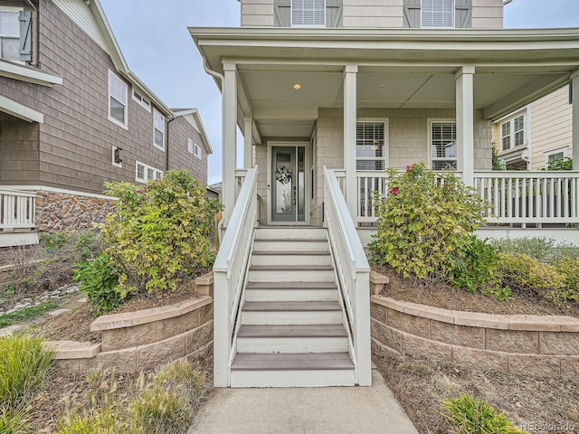 entrance to property with a porch