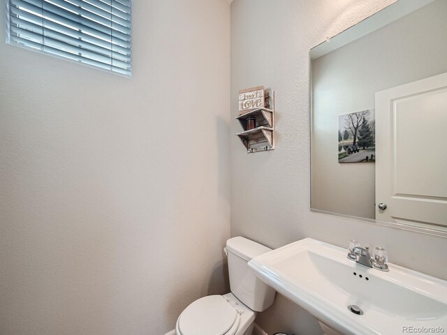 bathroom with sink and toilet