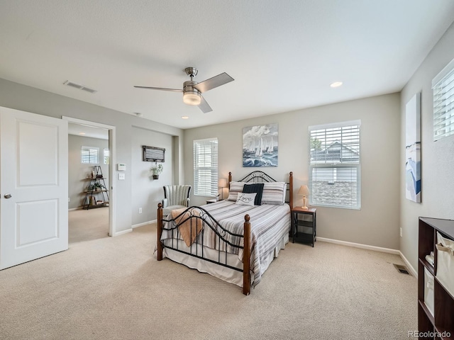 carpeted bedroom with ceiling fan