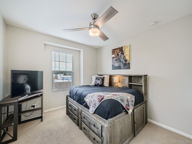 carpeted bedroom with ceiling fan