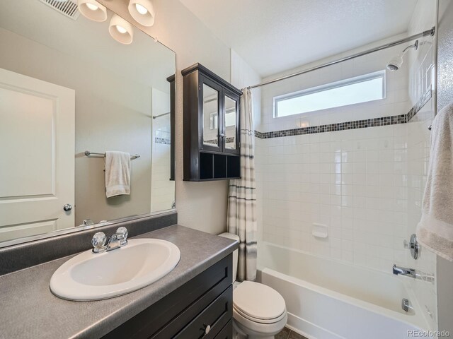 full bathroom featuring vanity, toilet, and shower / bath combo with shower curtain