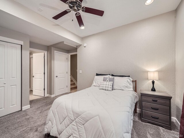 bedroom featuring a closet, ceiling fan, and carpet floors