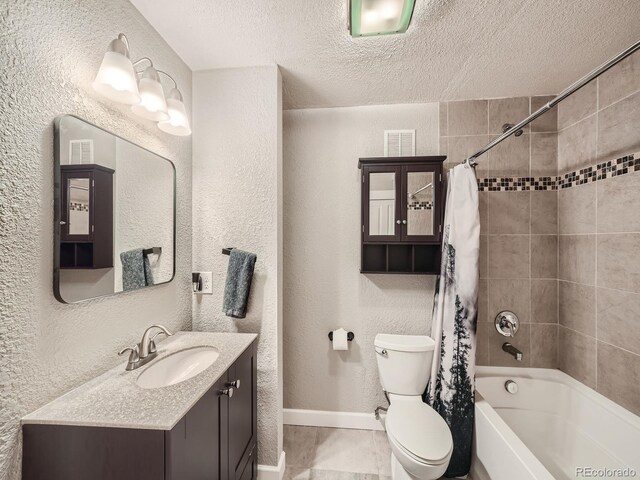 full bathroom with shower / bath combination with curtain, vanity, toilet, and a textured ceiling