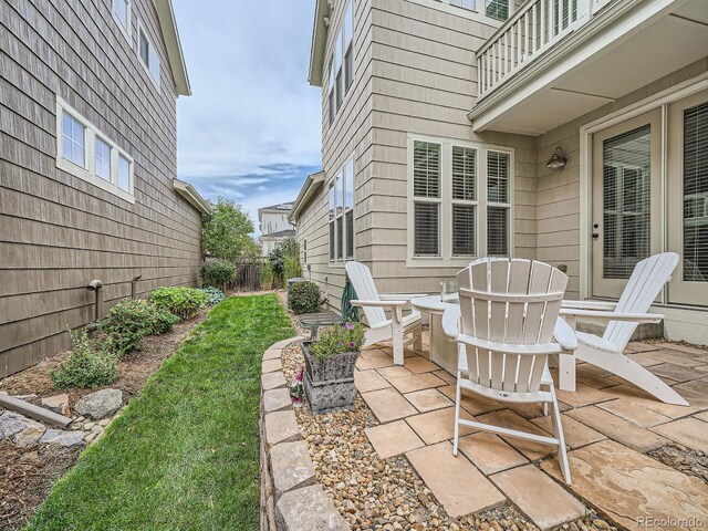 view of patio featuring a balcony